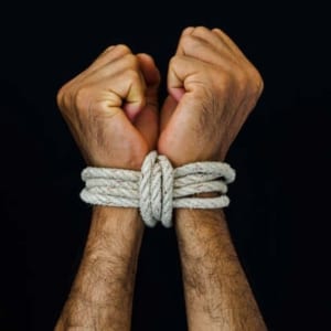 Man hands were tied with a rope. Violence, Terrified, Human Rights Day concept.